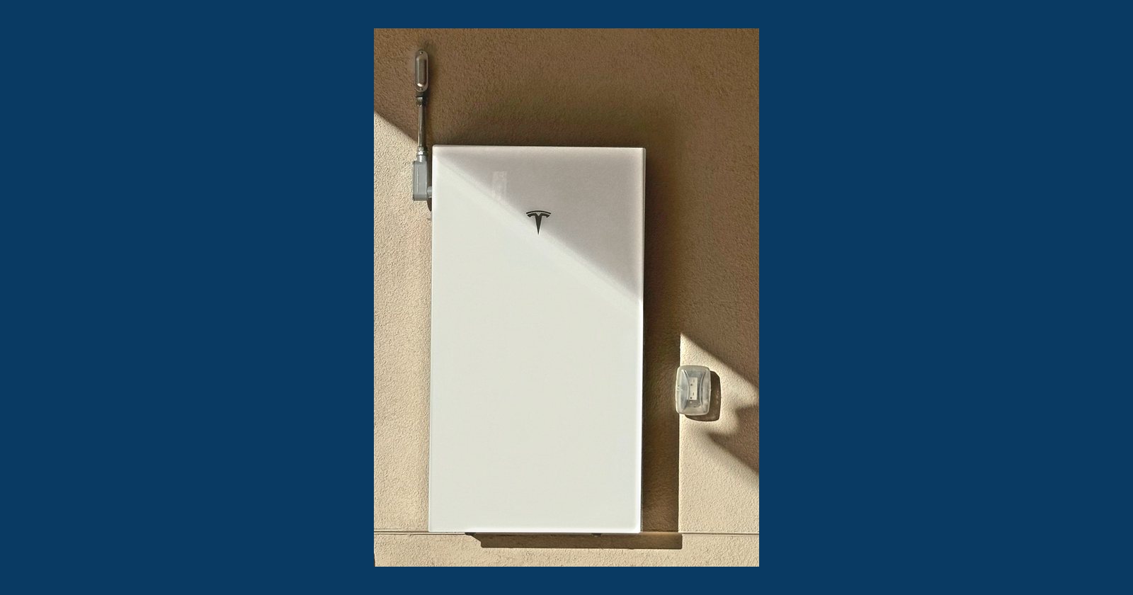 Tesla Powerwall 3 home battery mounted on the side of a San Diego home.